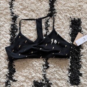 Black Sports Bra with Gold Accents peloton